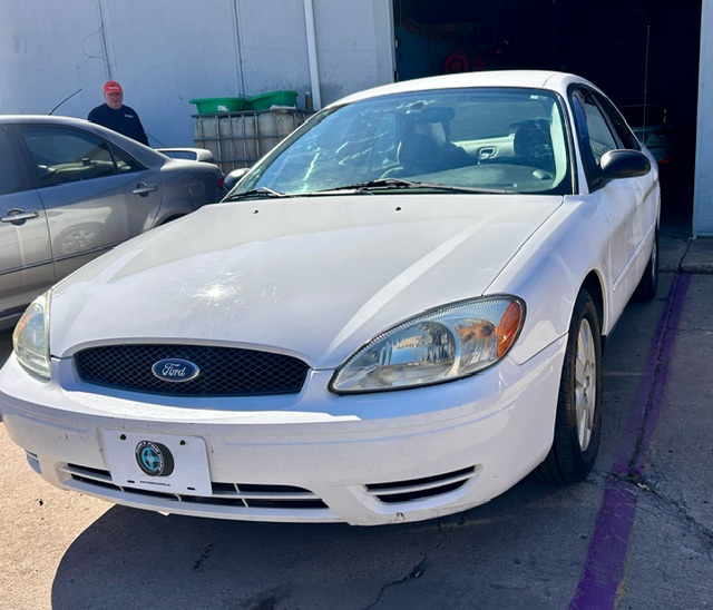White 2005 Ford Taurus for charity